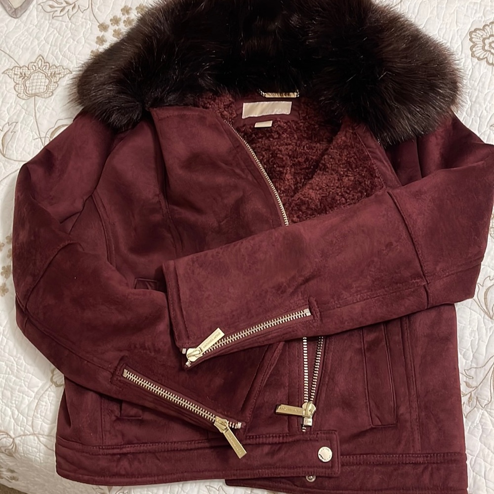 Purple fluffy zip up jacket by Michael Kora